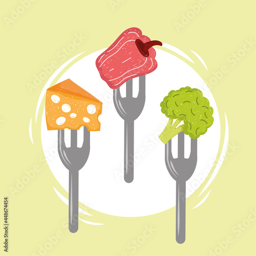 vegetables and cheese in forks