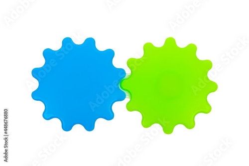 Educational children's toy, blue and green gear wheel on a white background, isolated image