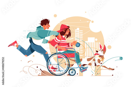 Guy and a woman in wheelchair