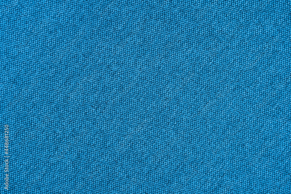 Blue texture of fabric from a textile material for an abstract background for an empty surface and for wall-paper. Blue texture of fabric from a textile material for an abstract background for an empty surface and for wall-paper.