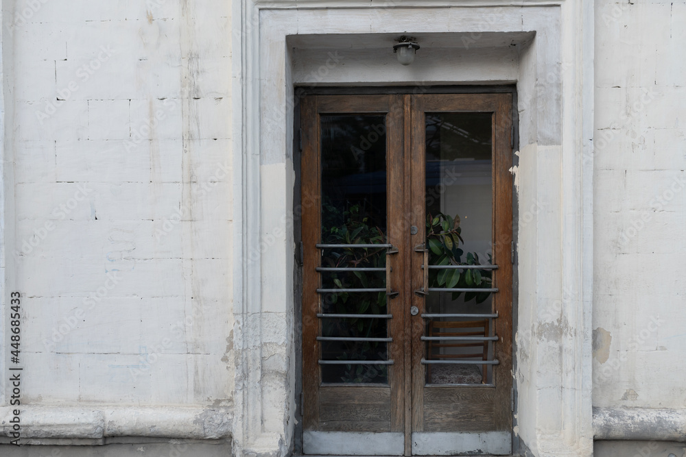 old wooden doors and white wall old wooden doors and white wall