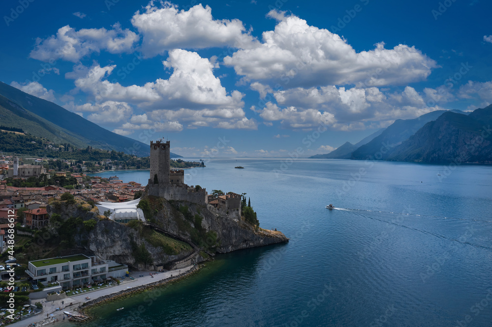 The historic town of Malcesine on Lake Garda, Italy. Castle of Malcesine, panorama aerial view. Castle on Lake Garda top view.