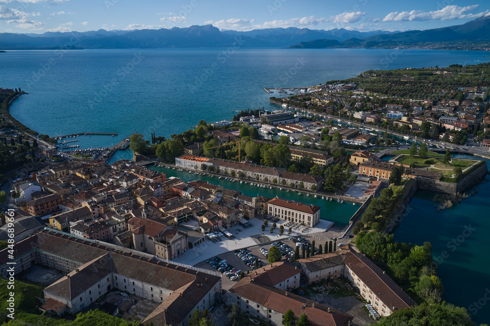 Aerial panorama of the city of Peschiera del Garda on Lake Garda, Italy. Aerial view of a tourist town in Italy. The city of peschiera del garda at sunset. Italian resorts on Lake Garda. Aerial panorama of the city of Peschiera del Garda on Lake Garda, Italy. Aerial view of a tourist town in Italy. The city of peschiera del garda at sunset. Italian resorts on Lake Garda.