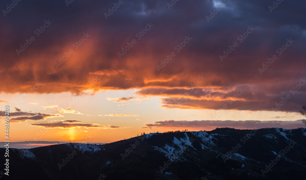 Sunset over snowy mountains, Transylvania region, Romania, Europe