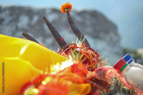 Closeup of Trishul in a hindu temple along with other items photo