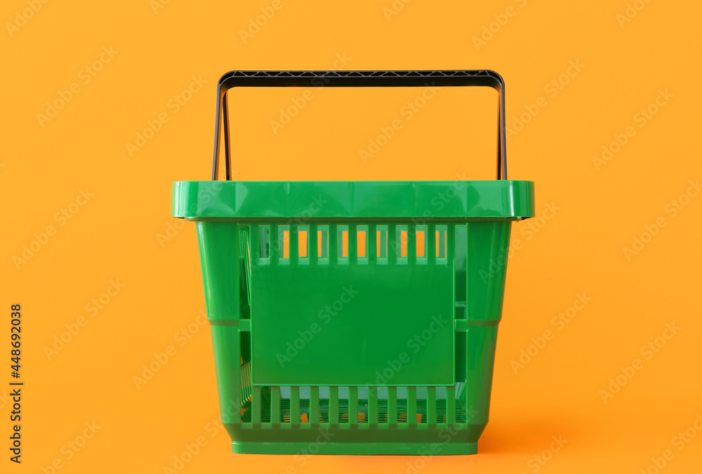 Fototapeta premium Shopping basket on color background
