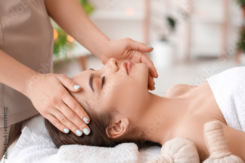 Young woman receiving face massage in beauty salon © Pixel-Shot