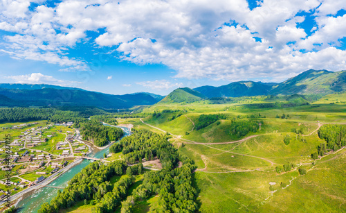 Beautiful Hemu Village with natural scenery in Xinjiang green mountain and forest with rivers.Hemu Village is a famous travel destination in China.Aerial view.