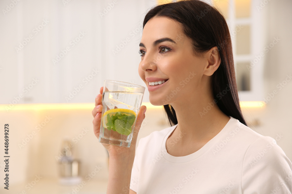 Young woman with glass of fresh lemonade at home Young woman with glass of fresh lemonade at home