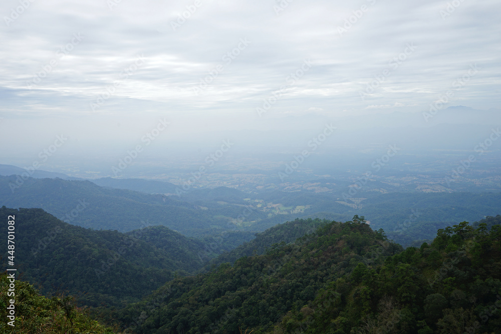 Natural landscape of green mountain range with cloudy blue sky Natural landscape of green mountain range with cloudy blue sky