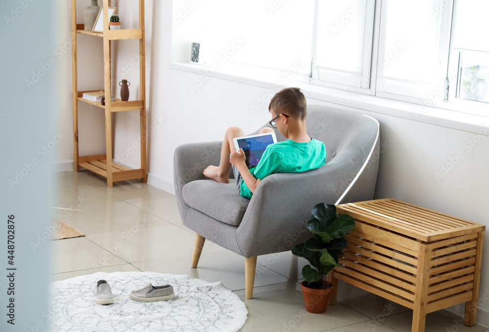 Cute boy watching cartoons at home Cute boy watching cartoons at home