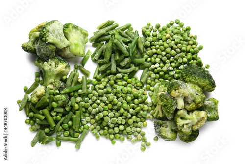 Frozen green vegetables on white background