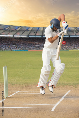Photography Batsman defending a ball During a match in the stadium