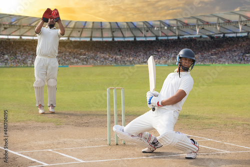 Фотография Batsman avoids a bouncer during a match in the stadium