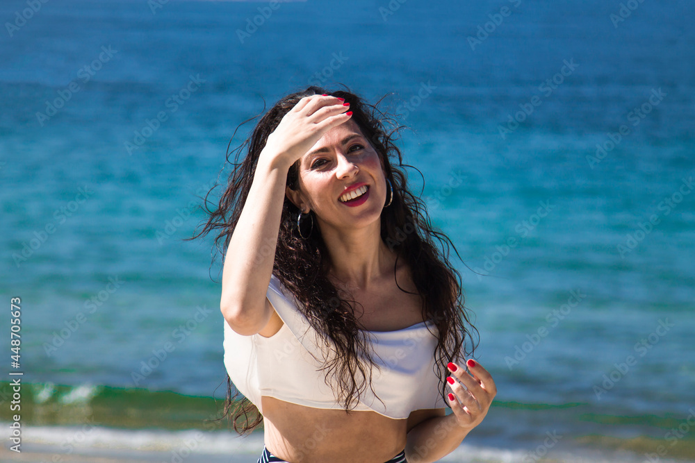portrait of smiling woman on the beach