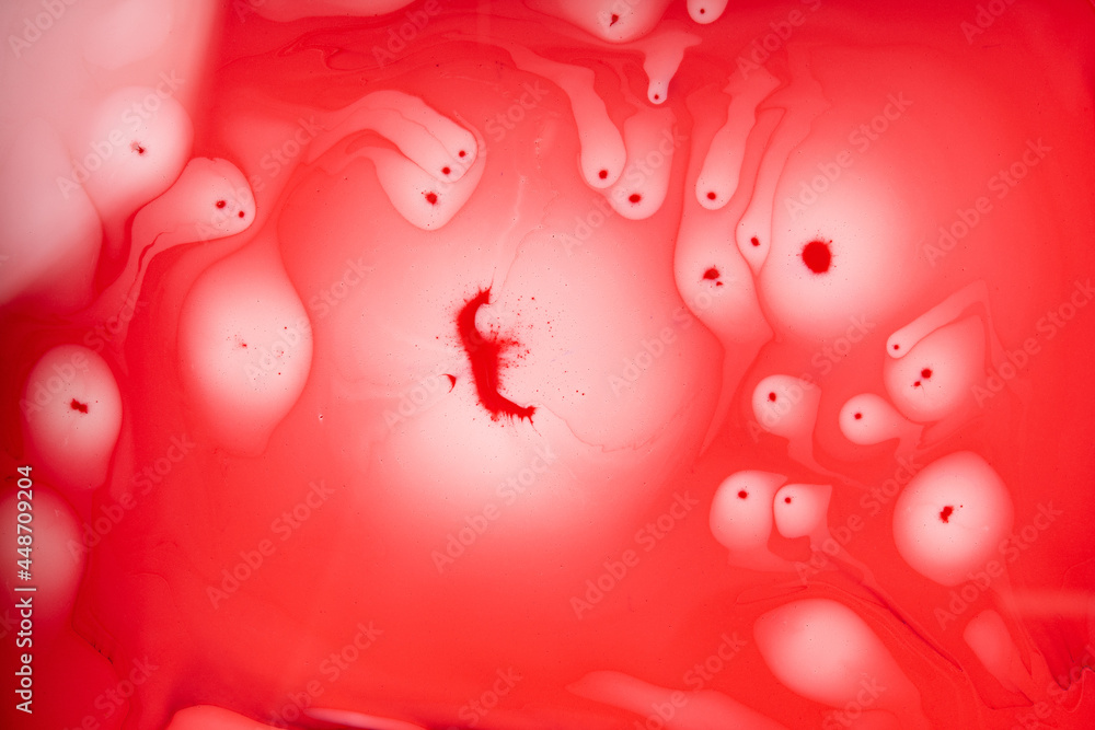 Stains of paint on the water,Abstract red background,Contemporary art. Stains of paint on the water,Abstract red background,Contemporary art.