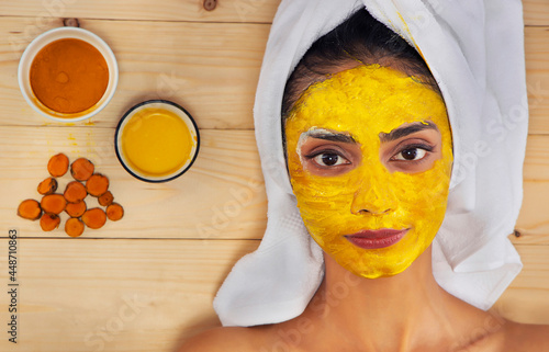 A young woman's face with home made face mask applied for skin care.