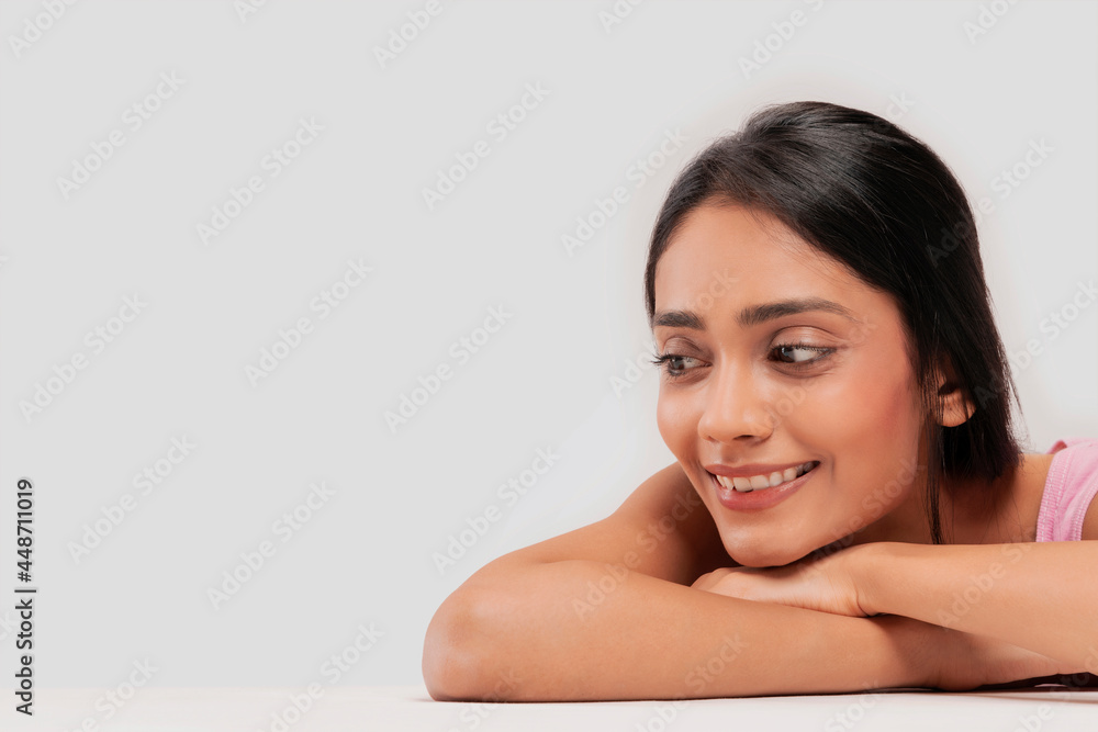 Portrait of a young woman with clear,spotless skin smiling. Portrait of a young woman with clear,spotless skin smiling.