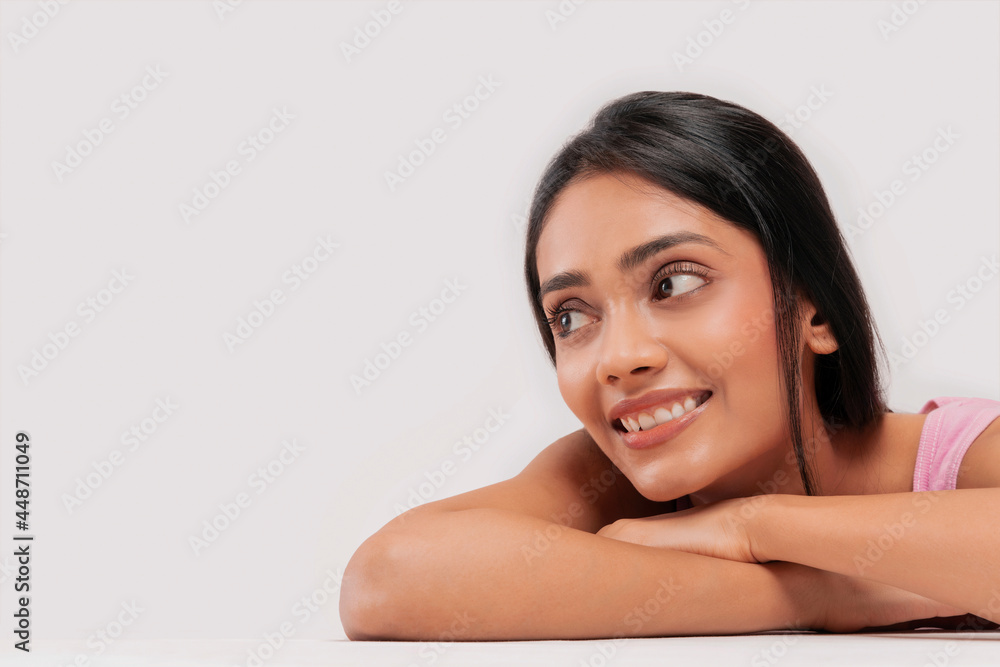 Portrait of a young woman with clear,spotless skin smiling. Portrait of a young woman with clear,spotless skin smiling.