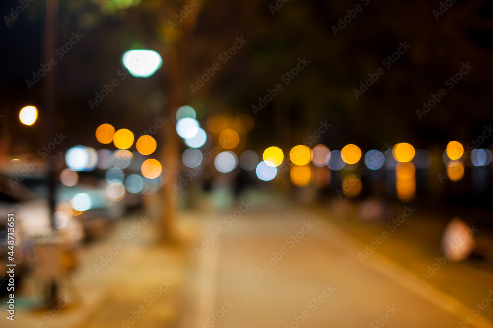 Blurred Street night pedestrians.