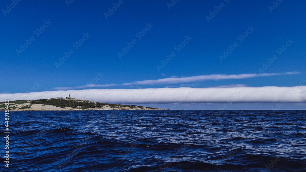 Large cigar cloud rolling in off the coast at Narooma, New South Wales, Australia