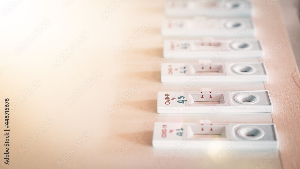 Covid-19 test kit Antigens, rapid detection placed on the table. Fast and large virus detection. Covid-19 test kit Antigens, rapid detection placed on the table. Fast and large virus detection.