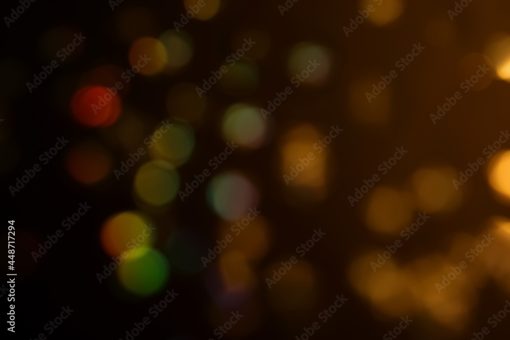 Blurred view of shiny glitter on black background. Bokeh effect Blurred view of shiny glitter on black background. Bokeh effect