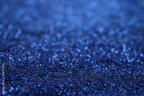 Shiny blue glitter as background. Bokeh effect