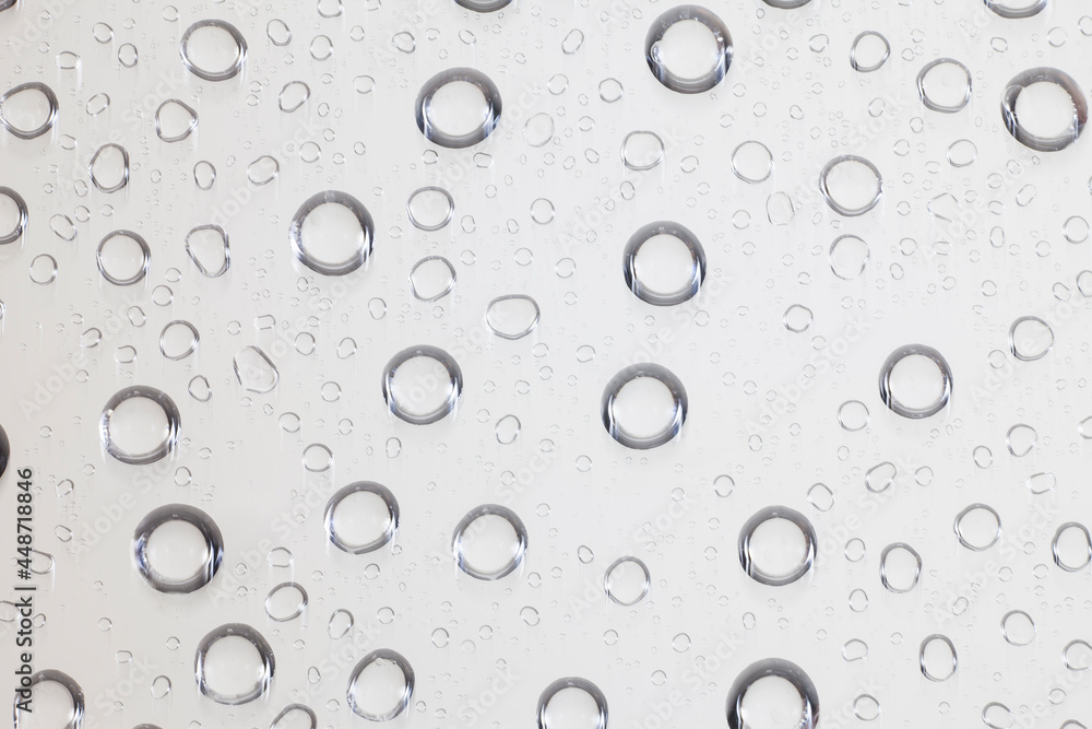 Water drops on clear glass background.