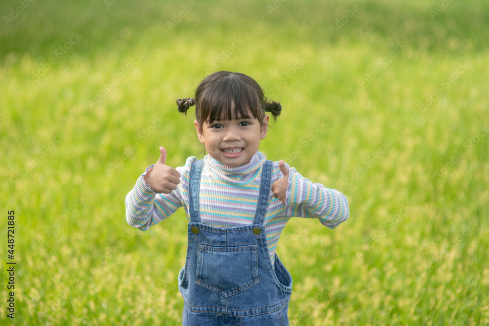 Portrait of happy pretty child girl smiling outdoors enjoying the warm sunny summer day. Portrait of happy pretty child girl smiling outdoors enjoying the warm sunny summer day.