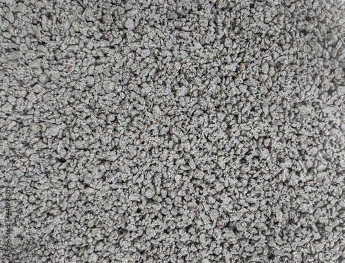 Gray and white marble chips. Monochrome. Natural Granite Chippings, Macadam, Rubble or Crushed Stones Background. Top view Broken Stone or Crushed Rock Texture with Place for Text