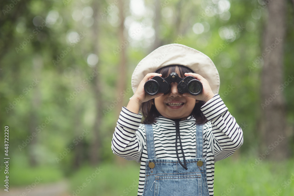 Happy kid looking ahead. Smiling child with the binoculars. Travel and adventure concept. Freedom, vacation Happy kid looking ahead. Smiling child with the binoculars. Travel and adventure concept. Freedom, vacation