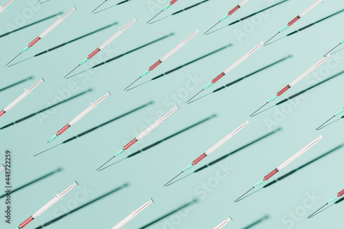 health pattern of syringes with red liquid
