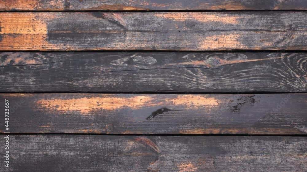 Close-up top view flatlay 4k stock video footage of old used vintage tool. Man puts old rusty axe on weathered wooden surface background Close-up top view flatlay 4k stock video footage of old used vintage tool. Man puts old rusty axe on weathered wooden surface background