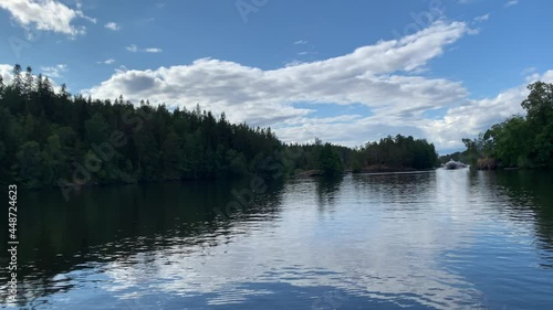 Russia Ladoga lake Valaam. The hydrofoil meteor is sailing on Lake Onega at high speed. going to the pier along the beautiful coast