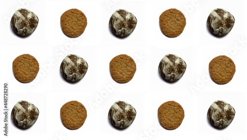 Gingerbread and oatmeal cookies are staggered on a white background. The pattern. Background for banners and designs. Wallpapers and textures. Abstraction