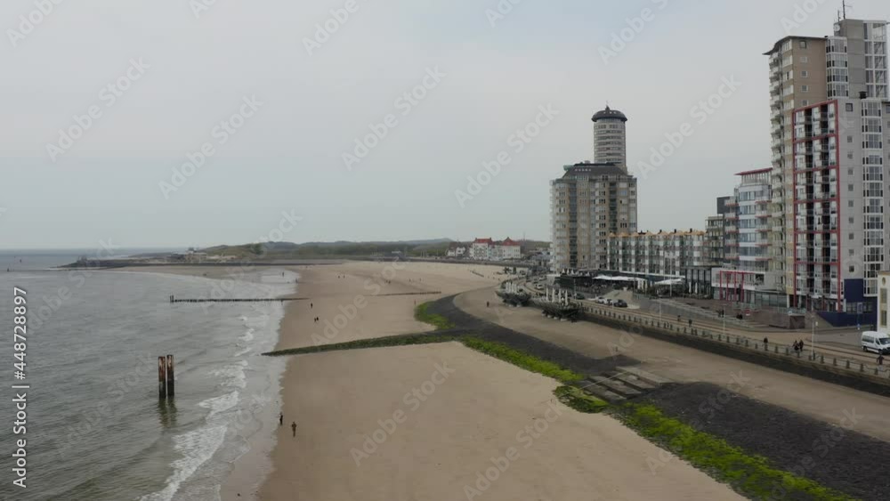 Aerial trucking shot of an empty city beach and coastal boulevard in Vlissingen, Zeeland, The Netherlands Aerial trucking shot of an empty city beach and coastal boulevard in Vlissingen, Zeeland, The Netherlands