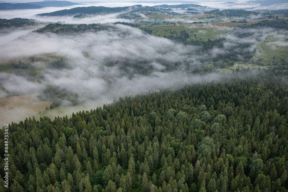 Aerial view on mountains in clouds from drone Aerial view on mountains in clouds from drone