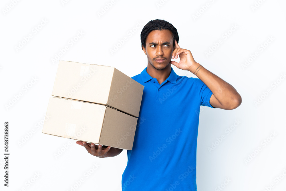 Delivery African American man with braids isolated on white background having doubts and thinking Delivery African American man with braids isolated on white background having doubts and thinking