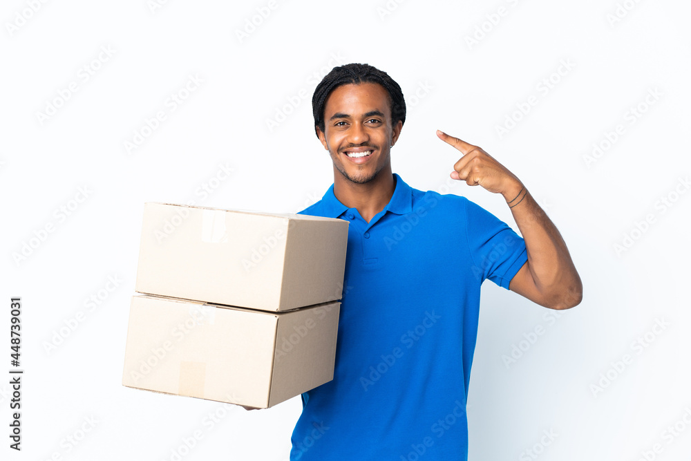 Delivery African American man with braids isolated on white background giving a thumbs up gesture Delivery African American man with braids isolated on white background giving a thumbs up gesture