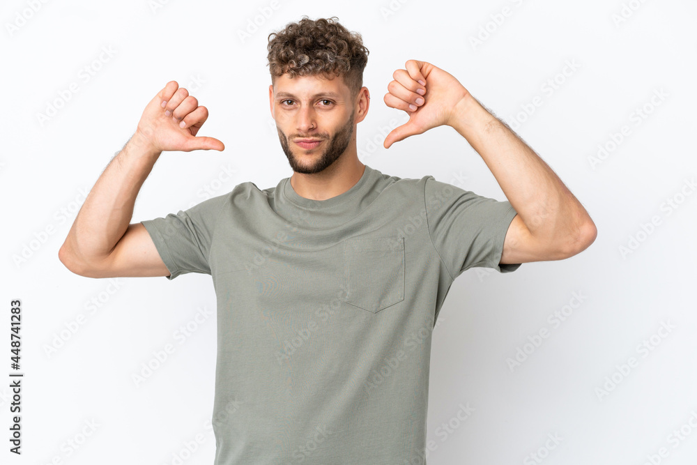 Fototapeta premium Young caucasian handsome man isolated on white background proud and self-satisfied