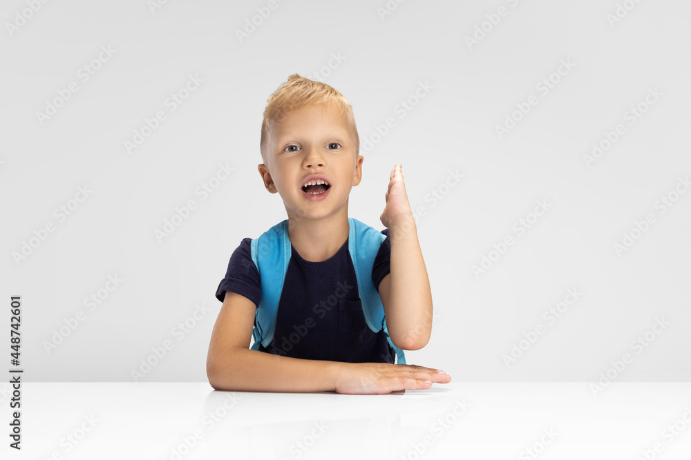 Close-up Caucasian preschool boy isolated on white studio background. Copyspace for ad. Childhood, education, emotion concept Close-up Caucasian preschool boy isolated on white studio background. Copyspace for ad. Childhood, education, emotion concept