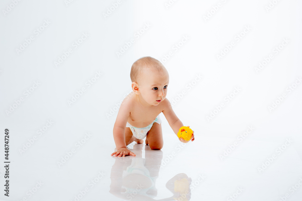 baby boy in a diaper crawling on a white background isolated baby boy in a diaper crawling on a white background isolated