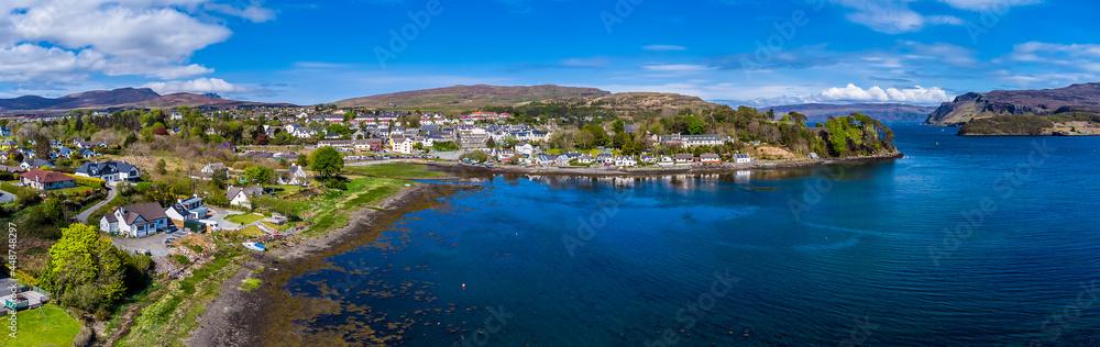 An panorama aerial view towards the southen bay of Portree on the Isle of Skye, Scotland on a summers day