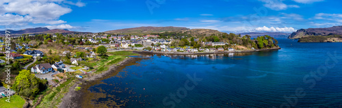 Fototapeta Naklejka Na Ścianę i Meble -  An panorama aerial view towards the southen bay of Portree on the Isle of Skye, Scotland on a summers day