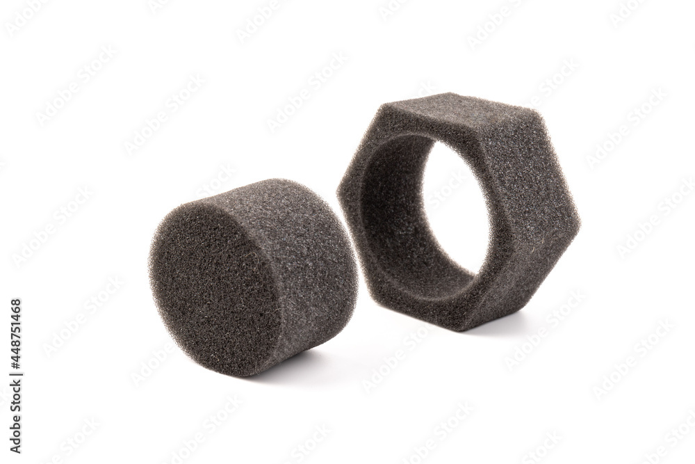 piece of foam rubber on white background. Black sponge piece of foam rubber on white background. Black sponge
