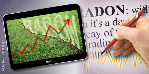 A green mowed lawn with a diagonal crack with radon gas escaping - Chart concept image with 3D render of a digital tablet photo