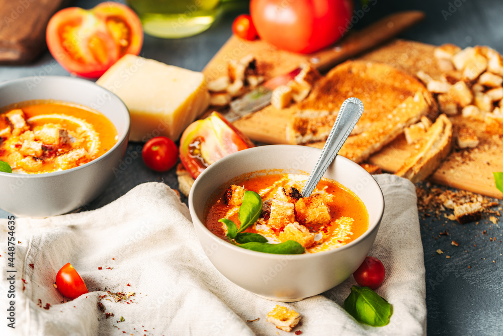 Tomato soup. Tomato creme with basil and bread.  Bowl with italian tomato soup.  - obrazy, fototapety, plakaty 