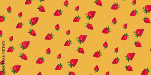 Seamless background with fresh strawberries. Juicy strawberries isolated on a yellow background.