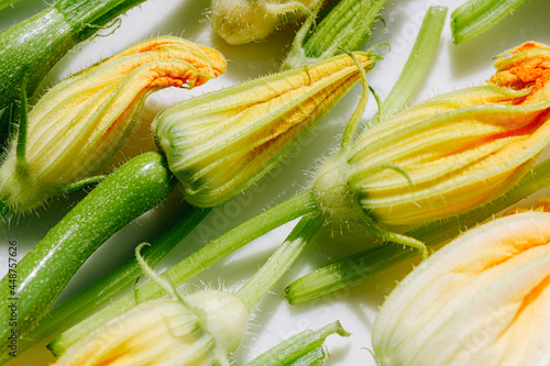 zucchini flowers in varying degrees of disclosure, ready to cook